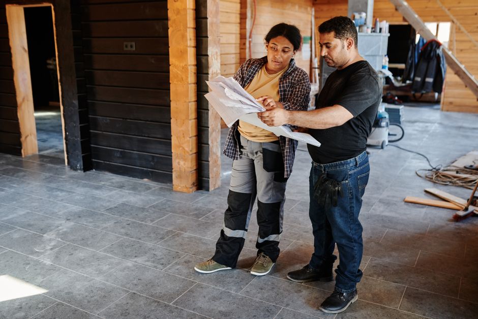 Contractor reviewing blueprints